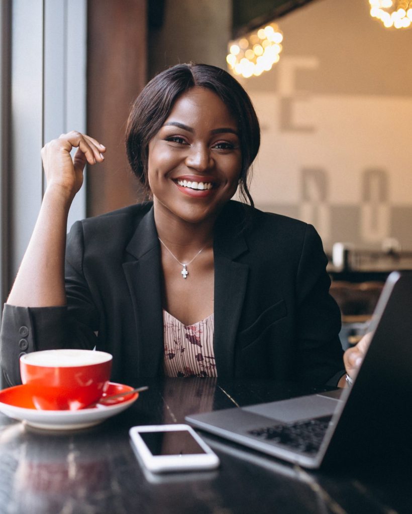 African american business woman working in a cafe